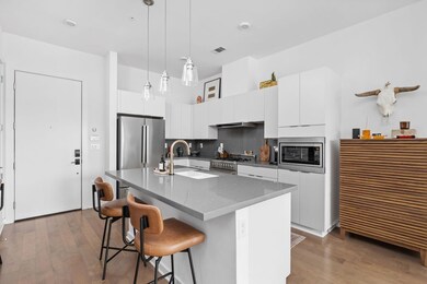 Kitchen featuring a kitchen breakfast bar, visibl