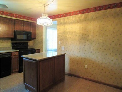 Kitchen large enough for a small table.