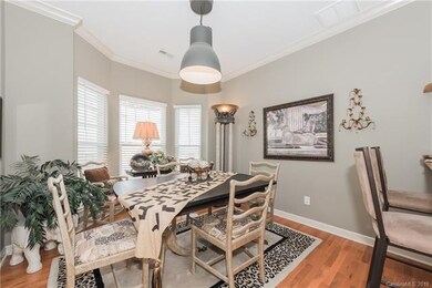 Formal dining room with custom light fixture, hard
