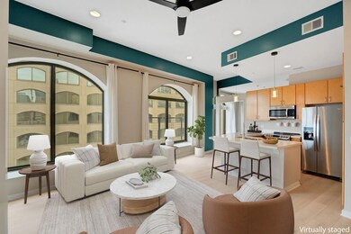 Living area with recessed lighting, visible vents