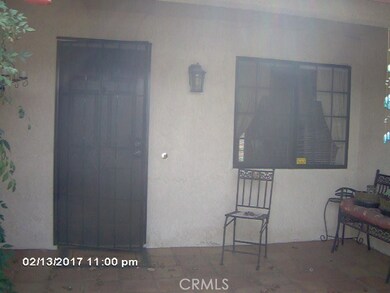 Courtyard with Saltillo tile and rose bushes