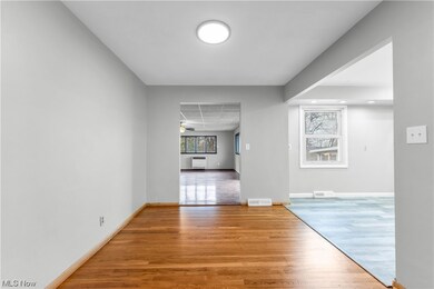 Corridor with light wood-type flooring