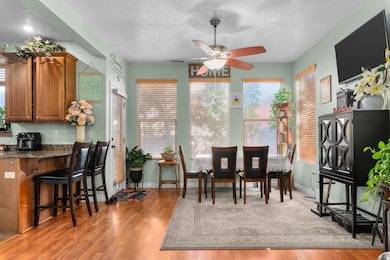 Dining room featuring a light wood floors and ceiling fan