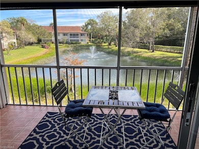 Sunroom / solarium with a water view and a wealth 