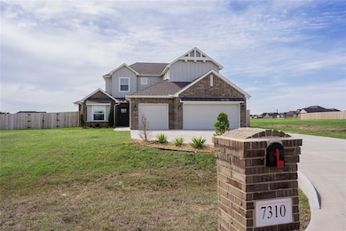 Craftsman inspired home with fence, brick siding, 