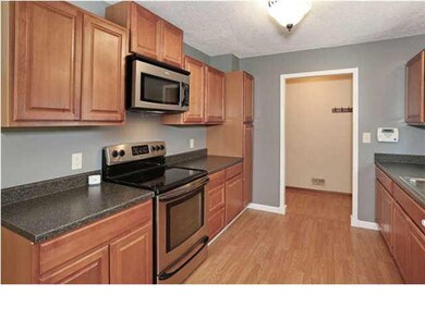 Kitchen has updated countertops and Whirlpool appl