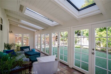 Relaxing sunroom with skylights