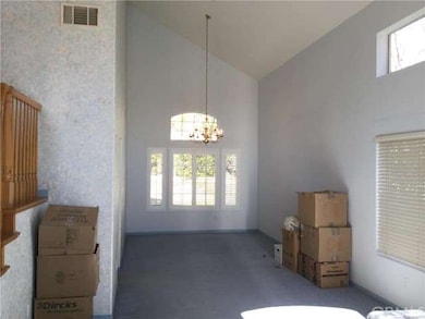 lovely dining area with high ceilings and natural 