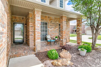 Property entrance with covered porch and a garage