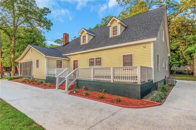 Side view of the house with the side porch. Circle