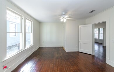 Empty room featuring dark hardwood / wood-style fl