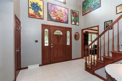 Beautiful wood doorway and large window atop allow