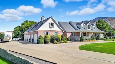 View of front of house featuring driveway, brick siding, a porch, a garage, and roof with shingles