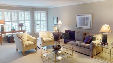 Living room  with wall of bay windows with firepla