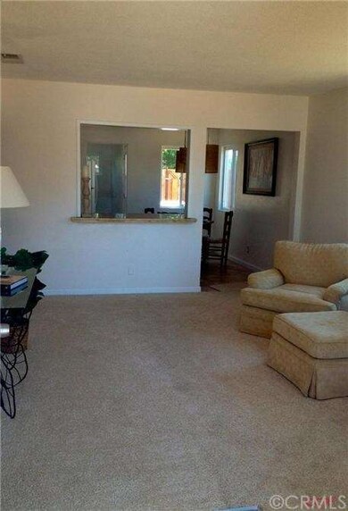 Living room opens to kitchen