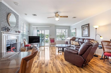 LIVING ROOM LOOKING OUT LARGE GLASS WINDOWS AND DO