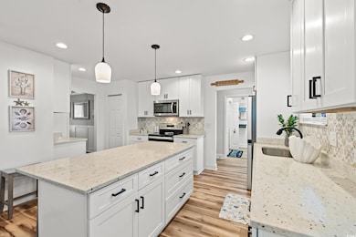 Kitchen featuring light wood-type flooring, a kitc