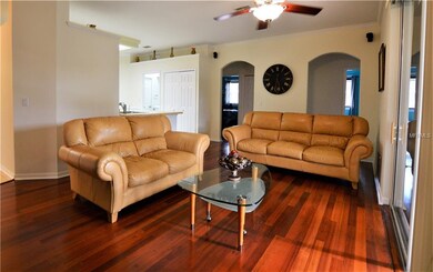 Family room, sliders open to Lanai and wood floors