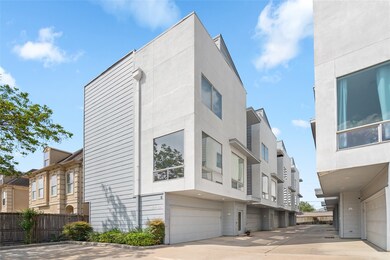 Modern three-story townhome in a gated community.
