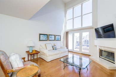 Soaring vaulted ceilings with floor to ceiling win