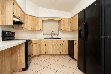 Kitchen has lots of cabinetry and counter space.