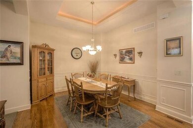 The Formal Dining Room located off the front entry can accommodate a large table or the space could be used for a variety of other needs.
