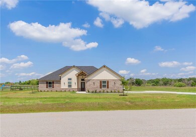 View of front of property with brick siding and bo