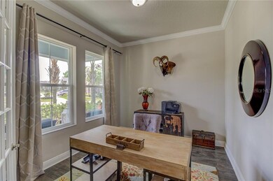 Den with Oversized windows creating a front yard v
