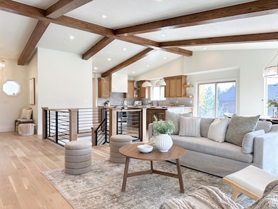 Living room featuring hardwood floors and natural light.