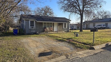 View of front of home with a porch and a front yar