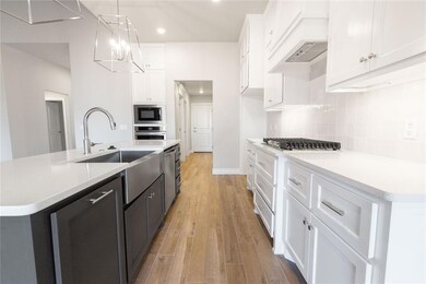 Kitchen with decorative backsplash, light countert