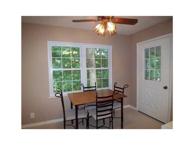 Kitchen. Eat-in kitchen has wooded views.
