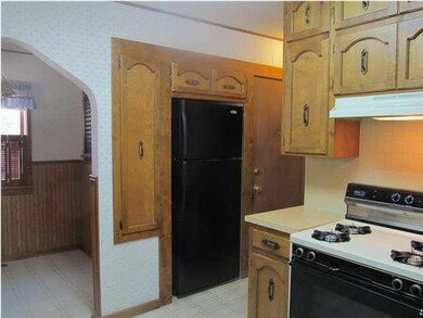 Refrigerator is flush with cabinets - note gas sto