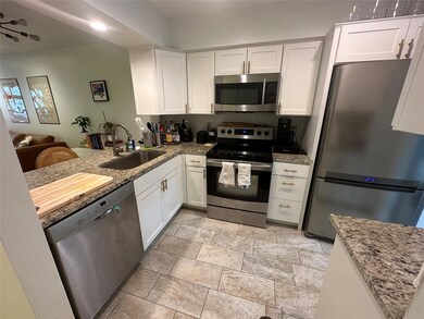 Kitchen featuring a sink, backsplash, stainless s