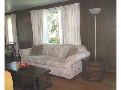 Living Room. Living room has a large window, hardw