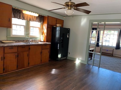 Lg kitchen-opens to LR-pine cabinets