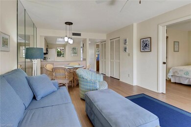 Living area with visible vents, a ceiling fan, and