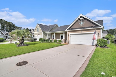 Craftsman inspired home with a front lawn, an attached garage, driveway, central air condition unit, and roof with shingles