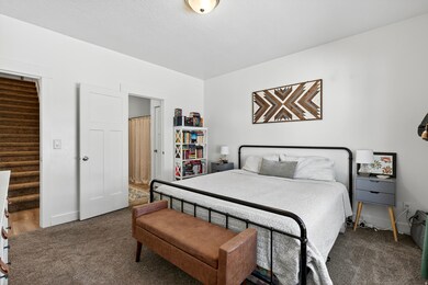 Carpeted bedroom featuring baseboards
