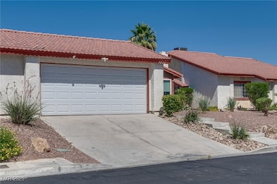 Single story home with a tiled roof, stucco siding
