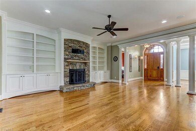 Living Room with Built-in's and stone fireplace