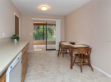 Kitchen dinette has pocket sliders to large lanai.