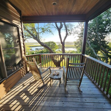 Wooden terrace featuring a water view