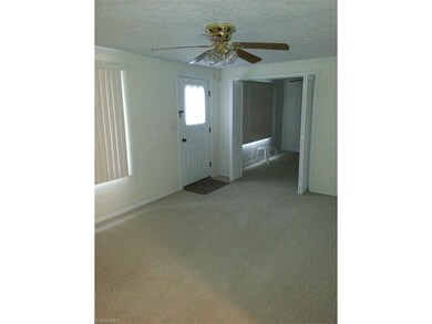 Large living room adjacent to a first floor bedroo