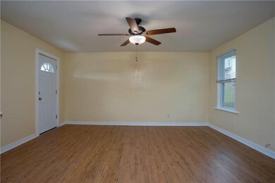 LIVING ROOM - Quite sizable featuring ceiling fan 