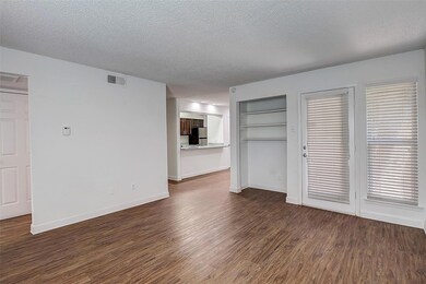Unfurnished living room with dark hardwood / wood-