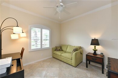 Den, with crown molding, and tile on the diagonal,