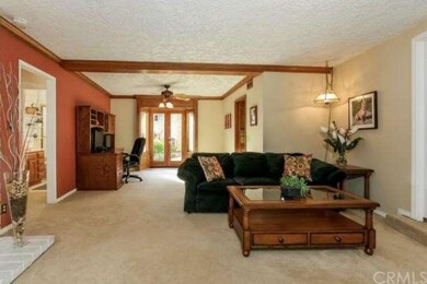 Spacious living room with fireplace and adjoining 