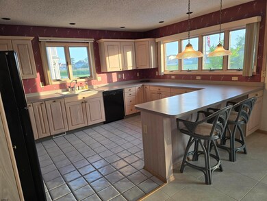 Open to Family Room.  This could be an amazing space with little effort and vision