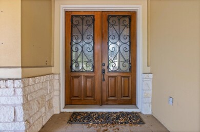 Doorway to property featuring stone siding